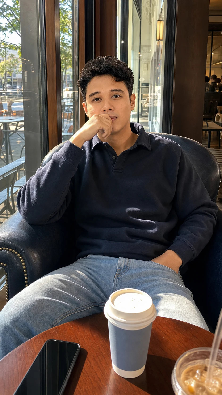 Arvin seated at a cafe